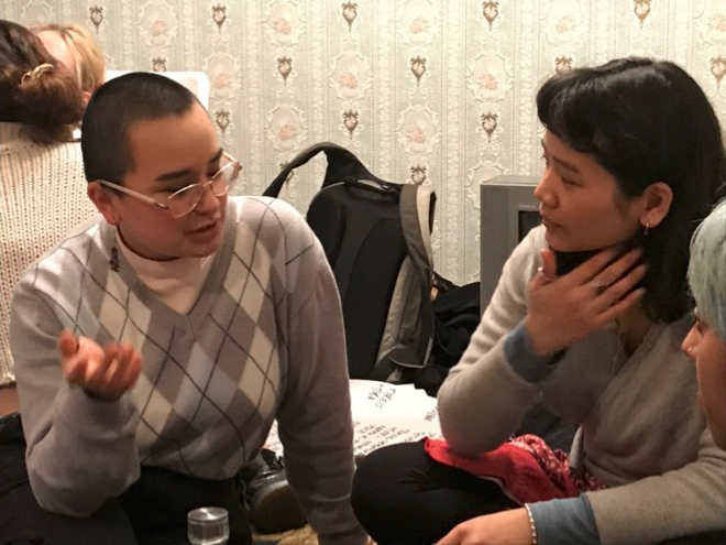 Two students sitting and talking